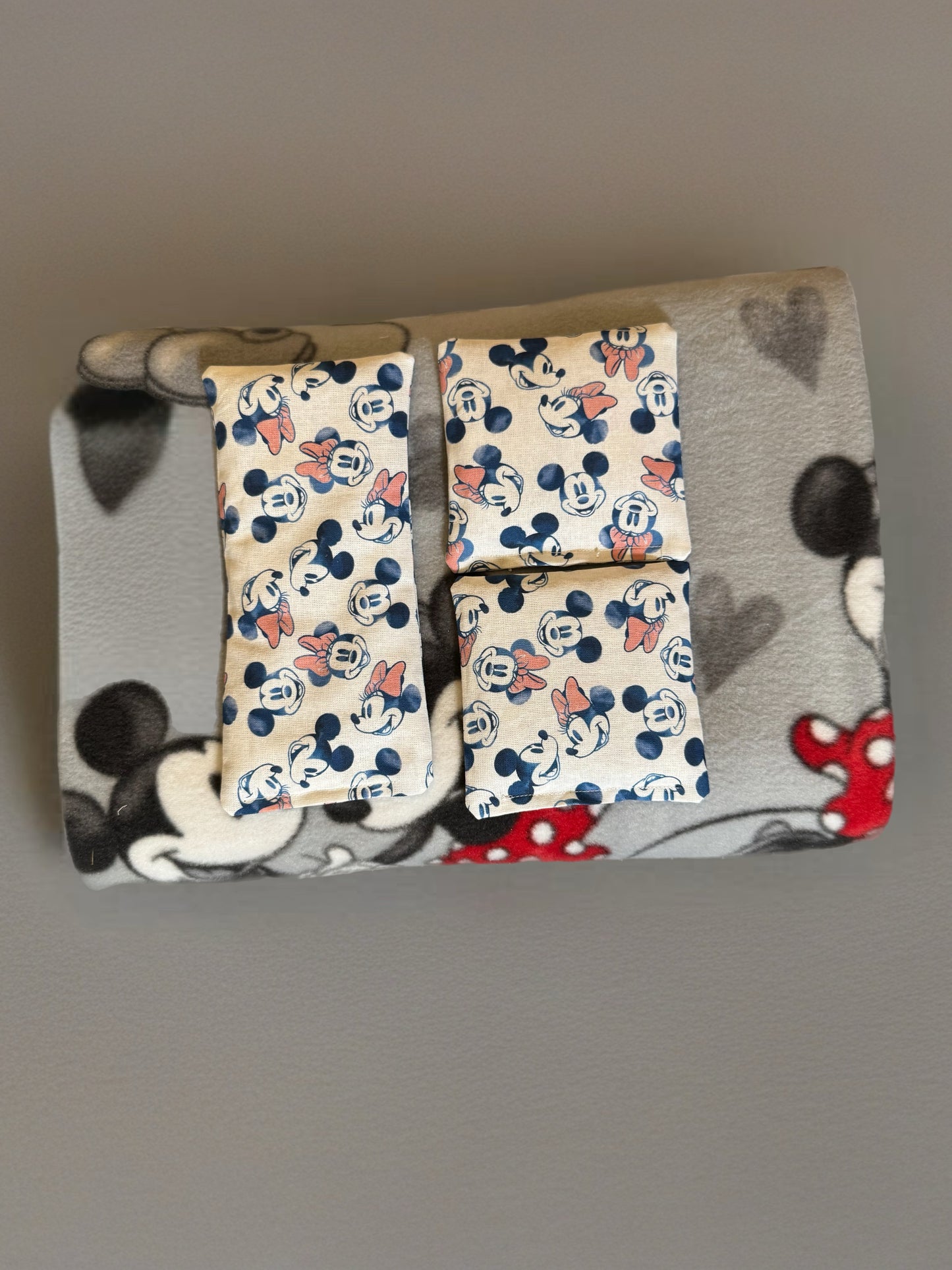 Mickey & Minnie Comfort Set By Handmade Designs by Shannon LLC Snuggle up with timeless characters and cozy comfort!